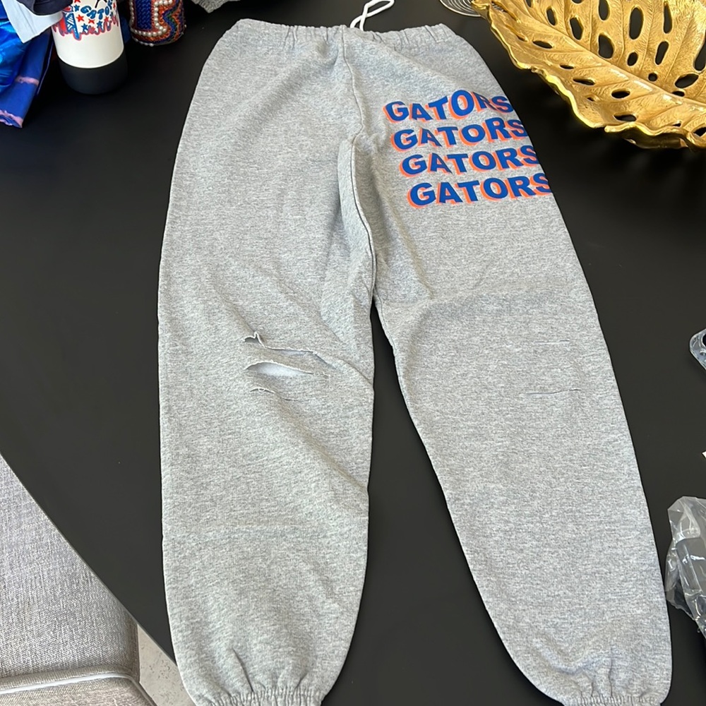 university of floras grey ripped sweatpants